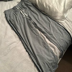 New pants; never worn. Black stripes. Pockets. White tie strings.